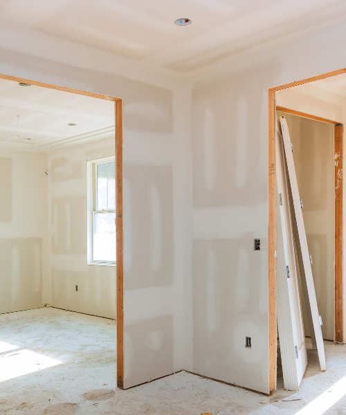 A room that is being remodeled with a ladder