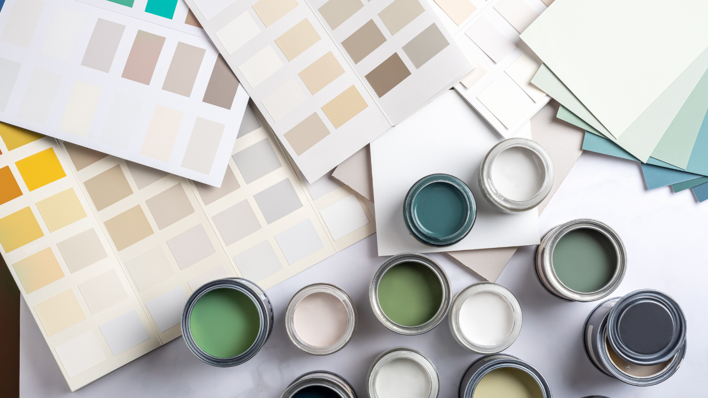 A group of paint cans sitting on top of a table