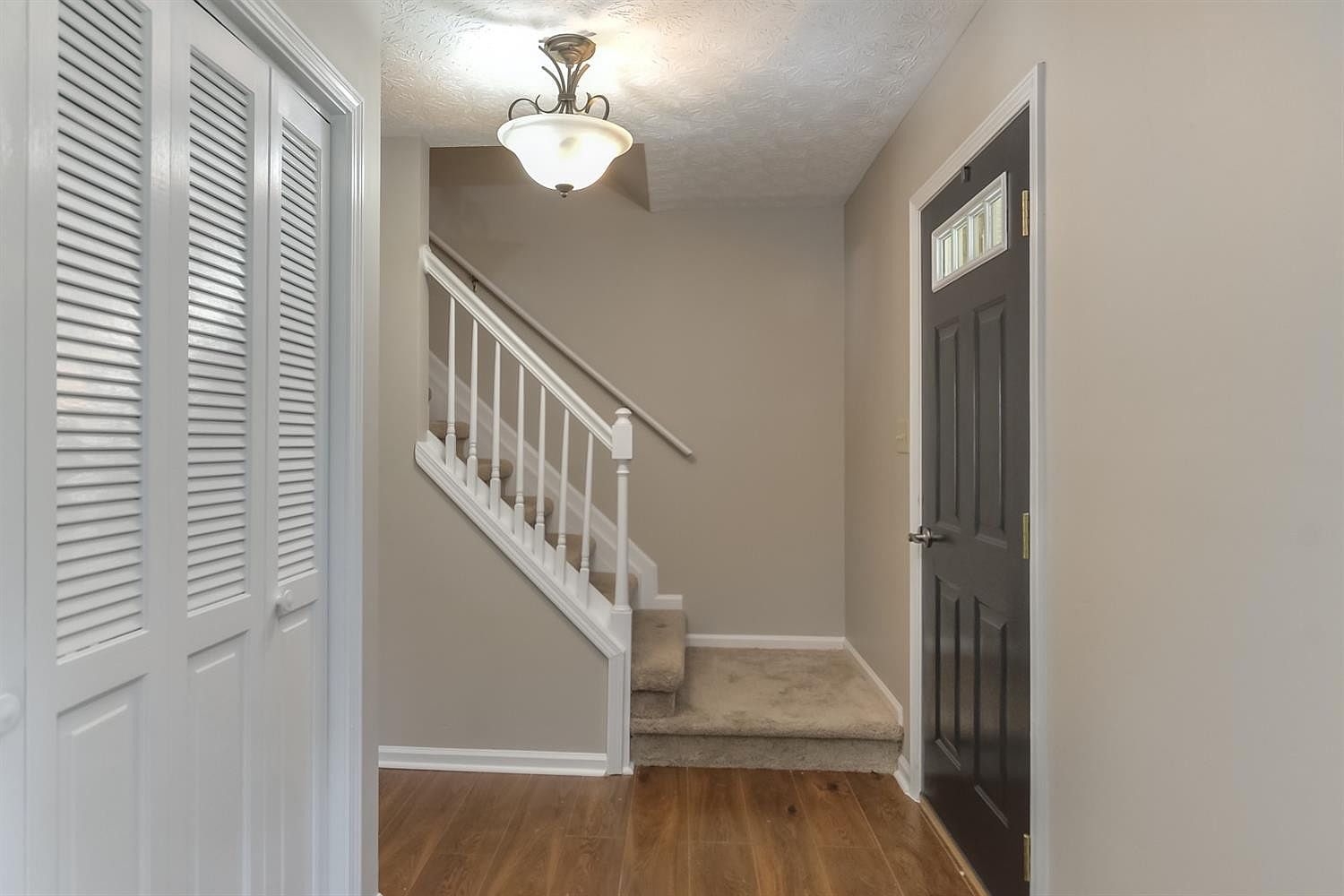 Freshly painted entryway and staircase with white trim – Idylwild Drive, Richmond, KY